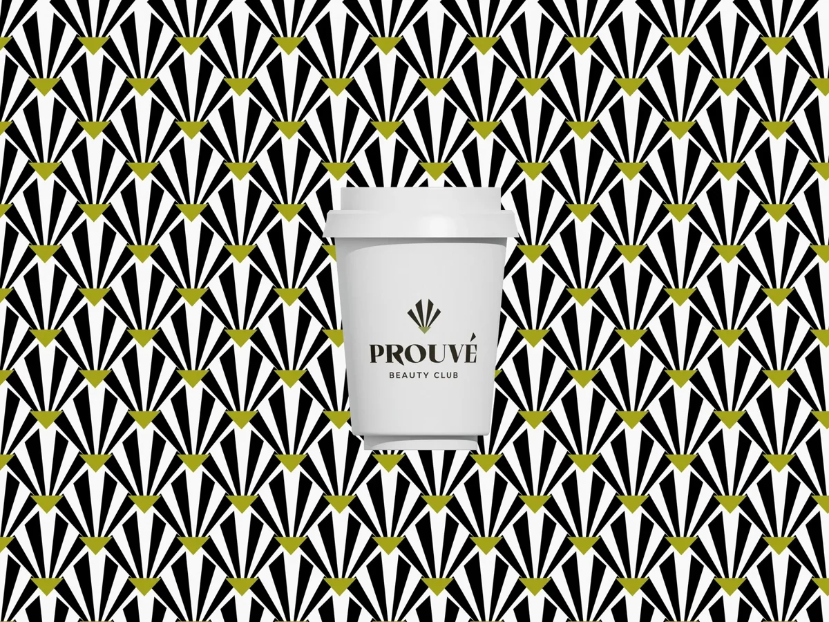 PROUVÉ Beauty Club cup against a black, white and olive repeating fan pattern